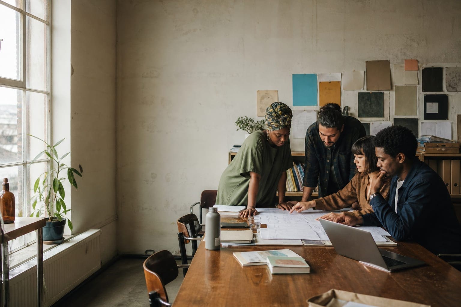 Nonprofit leaders building plans together in a community workspace
